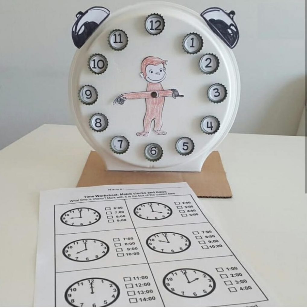 paper plate and bottle caps telling time 